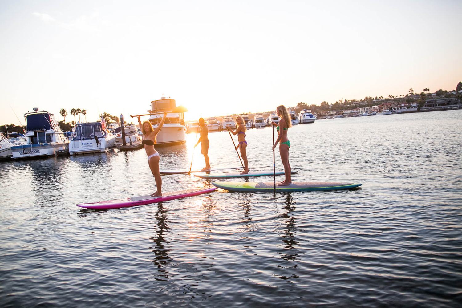 Group paddle boarding event in Newport Beach