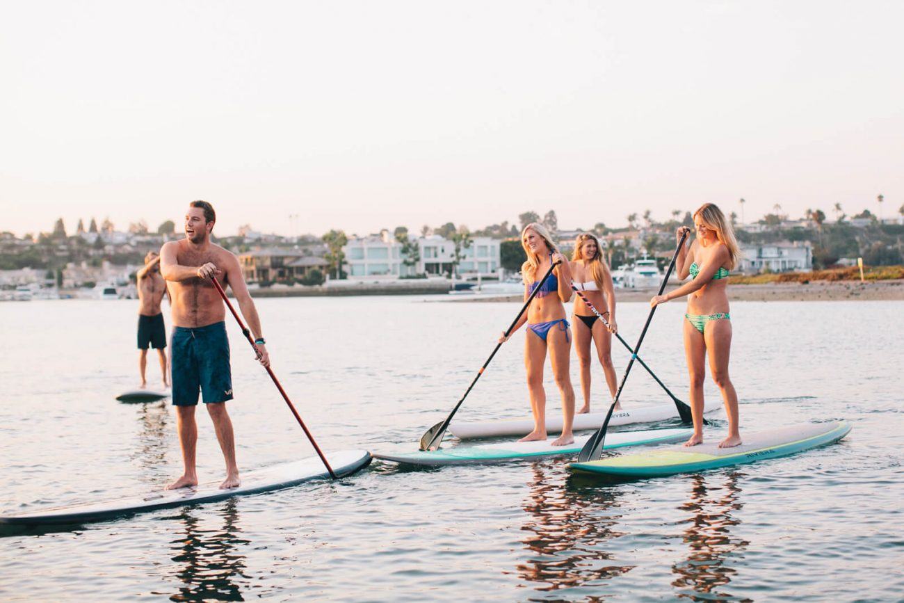 Group paddle boarding event in Newport Beach