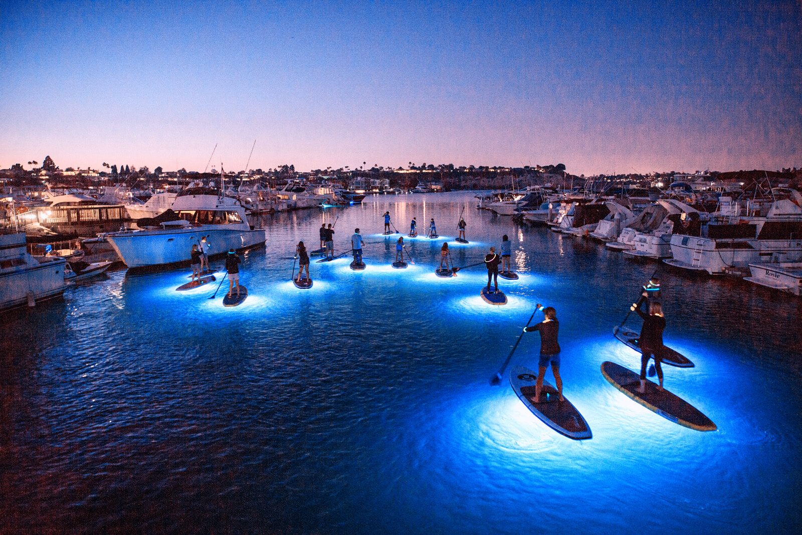 SUP Glow night paddle boarding in Newport Beach