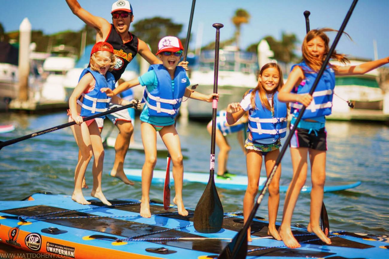 Group paddle boarding event in Newport Beach